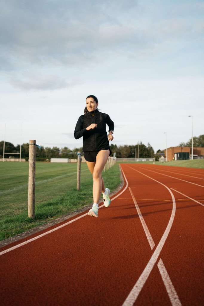 Mel running on a track